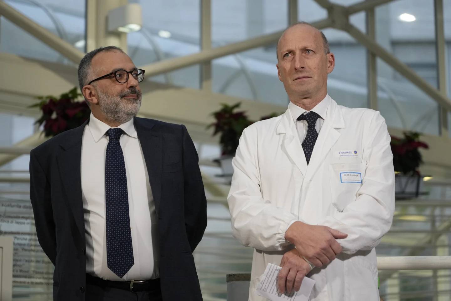 From left, head physician of Vatican's Health and Hygiene Office, Luigi Carbone, and Surgeon Sergio Alfieri, speak to journalists, Saturday, March 22, 2025, in the entrance hall of Rome's Gemelli Hospital. (Credit: Gregorio Borgia/AP.)
