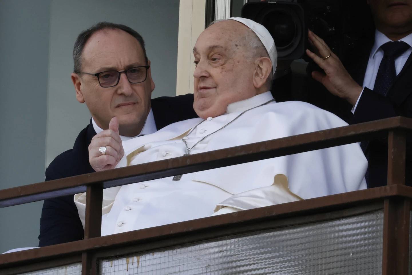 Pope Francis appears at a window of the Gemelli Hospital in Rome, Sunday, March 23, 2025, where he was treated for bronchitis and bilateral pneumonia. (Credit: Riccardo De Luca/AP.)