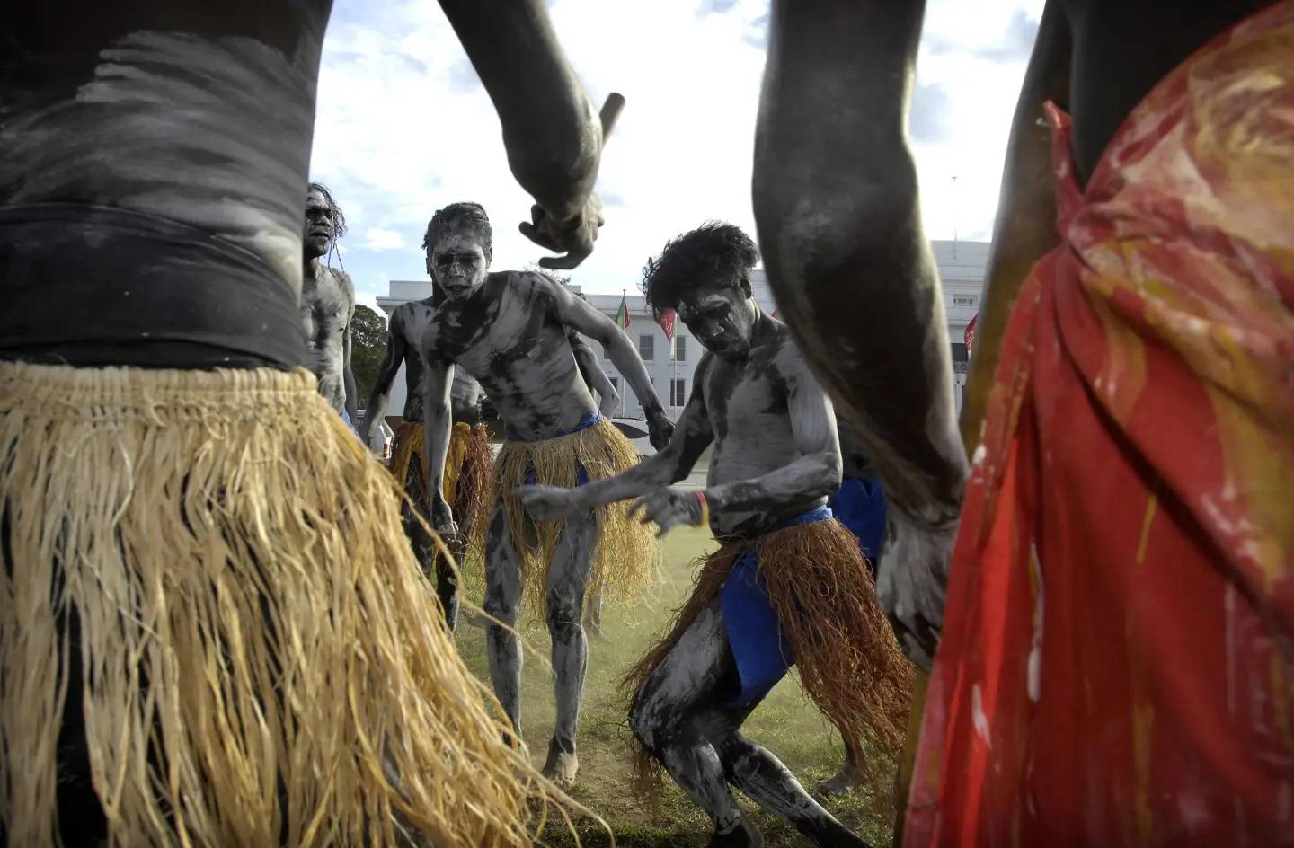 Aboriginals dance in front of Old Parliament House in Canberra, Australia on Feb. 11, 2008. (Credit: Mark Graham/AP.)